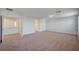 Large bonus room offering flexible living space with neutral carpeting at 10306 Coastline Creek Ct, Las Vegas, NV 89141