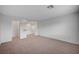 Spacious upstairs bonus room ready for customization with fresh carpet at 10306 Coastline Creek Ct, Las Vegas, NV 89141