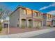 Charming two-story home features desert landscaping, a tile roof, and an attached two-car garage at 10306 Coastline Creek Ct, Las Vegas, NV 89141