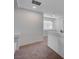 Upstairs hallway with plush carpeting, white walls, and natural light at 10306 Coastline Creek Ct, Las Vegas, NV 89141