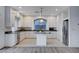 Modern kitchen with stainless steel appliances, central island, and ample cabinet space at 10306 Coastline Creek Ct, Las Vegas, NV 89141