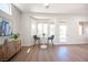 Dining nook with natural light from a bay window next to an accent cabinet with decor at 10624 Mission Lakes Ave, Las Vegas, NV 89134