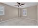 Neutral bedroom with plush carpeting and windows featuring plantation shutters at 12836 Alcores St, Las Vegas, NV 89141