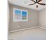 Neutral bedroom featuring plush carpeting and windows with shutter style blinds at 12836 Alcores St, Las Vegas, NV 89141