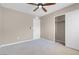 Bedroom featuring plush carpeting, a ceiling fan, and a sliding-door closet at 12836 Alcores St, Las Vegas, NV 89141