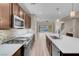Open concept kitchen with stainless steel appliances, spacious island, and views of the backyard at 12836 Alcores St, Las Vegas, NV 89141