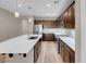 Well-equipped kitchen with stainless steel appliances, a center island, stylish backsplash, and ample lighting at 12836 Alcores St, Las Vegas, NV 89141
