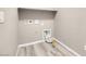 The laundry room has hard wood floors and utility connections at 12836 Alcores St, Las Vegas, NV 89141