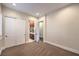 Neutral bedroom with plush carpet, window with plantation shutters, standard closet and bath access at 1477 Foothills Village Dr, Henderson, NV 89012