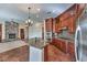 Gourmet kitchen with a central island, stainless steel appliances, and custom cabinetry at 1477 Foothills Village Dr, Henderson, NV 89012