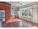 Bright breakfast nook with custom cabinets, granite countertops, and large windows at 1477 Foothills Village Dr, Henderson, NV 89012