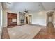 Inviting living room with stone fireplace, built-in cabinets, and terracotta tile floors at 1477 Foothills Village Dr, Henderson, NV 89012