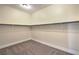Empty walk-in closet featuring carpet and a shelf at 1477 Foothills Village Dr, Henderson, NV 89012