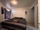 Bedroom with a bed, a window with curtains, and an open closet at 2101 Sun Ave, North Las Vegas, NV 89030