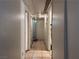 Hallway with tile floors, white walls, and multiple doorways at 2101 Sun Ave, North Las Vegas, NV 89030