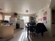 Kitchen with a dining table, refrigerator, and other appliances at 2101 Sun Ave, North Las Vegas, NV 89030
