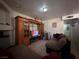 Cozy living room with tile flooring and large TV. Comfortable seating and storage space at 2101 Sun Ave, North Las Vegas, NV 89030
