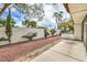 A serene backyard retreat, with a concrete patio, rock ground cover and a painted privacy wall at 2579 La Fortuna Ave, Las Vegas, NV 89121