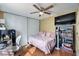 Cozy bedroom with a ceiling fan, personal workstation, and natural light at 2579 La Fortuna Ave, Las Vegas, NV 89121