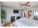 This bedroom features a TV, ceiling fan, and an electric fireplace at 2579 La Fortuna Ave, Las Vegas, NV 89121