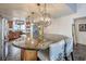 Kitchen view highlighting the oversized island, granite counters, stylish pendant lights, and seamless flow into adjacent spaces at 2579 La Fortuna Ave, Las Vegas, NV 89121