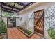 Enclosed patio with tiled floor, decorative pergola and string lights at 2579 La Fortuna Ave, Las Vegas, NV 89121