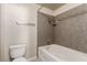 Bathroom with a toilet and bathtub with shower at 2606 S Durango Dr # 232, Las Vegas, NV 89117