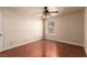 Bedroom with a ceiling fan, window, and hardwood floor at 2606 S Durango Dr # 232, Las Vegas, NV 89117