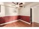 Comfortable dining area featuring decorative wainscotting, ceiling fan and adjacent entryway at 2606 S Durango Dr # 232, Las Vegas, NV 89117