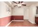 Comfortable dining area featuring decorative wainscotting, ceiling fan and adjacent wine rack at 2606 S Durango Dr # 232, Las Vegas, NV 89117