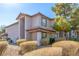 Exterior view of the condo building with well-manicured bushes and a desert landscape design at 2606 S Durango Dr # 232, Las Vegas, NV 89117