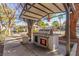 Grill area under a metal shelter with stainless grill surrounded by landscaping at 2606 S Durango Dr # 232, Las Vegas, NV 89117