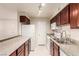 Well-lit kitchen featuring stainless steel appliances, granite countertops, and ample cabinet space at 2606 S Durango Dr # 232, Las Vegas, NV 89117