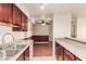 Updated kitchen with granite counters opening to a living area with elegant wainscotting at 2606 S Durango Dr # 232, Las Vegas, NV 89117