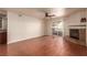 Spacious living room with a ceiling fan, wood floors and a fireplace at 2606 S Durango Dr # 232, Las Vegas, NV 89117