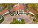 Expansive aerial view showcases the property's sprawling layout, lush landscaping, and circular driveway at 2818 E Quail Ave, Las Vegas, NV 89120