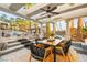 Outdoor dining area with covered patio and steps leading to a backyard pool at 2818 E Quail Ave, Las Vegas, NV 89120
