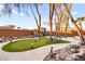 Backyard includes small putting green, gazebo with outdoor seating and walking path at 2818 E Quail Ave, Las Vegas, NV 89120