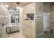 Luxurious bathroom with glass enclosed shower and marble tile at 2818 E Quail Ave, Las Vegas, NV 89120