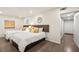 Bedroom featuring two beds with decorative pillows, modern lamps and a hallway entrance at 2818 E Quail Ave, Las Vegas, NV 89120
