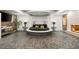 Bedroom featuring a circular bed, fireplace, mounted television, and ambient lighting at 2818 E Quail Ave, Las Vegas, NV 89120