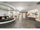 Eclectic bedroom with circular bed, fireplace, chandelier and mirrored sink area at 2818 E Quail Ave, Las Vegas, NV 89120