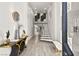 Contemporary foyer featuring a spiral staircase, high ceilings, and modern decor at 2818 E Quail Ave, Las Vegas, NV 89120