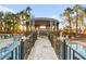 Outdoor gazebo featuring a bridge walkway, resort-style pool and lush palm trees at 2818 E Quail Ave, Las Vegas, NV 89120