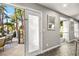 Hallway with access to patio area and glass railings overlooking the lush backyard at 2818 E Quail Ave, Las Vegas, NV 89120