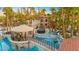 Spectacular pool area features a built-in bar, covered lounge area, and multiple water features at 2818 E Quail Ave, Las Vegas, NV 89120