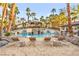 Resort-style pool and lounging area with a covered gazebo and tropical landscaping at 2818 E Quail Ave, Las Vegas, NV 89120