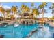 Stunning pool features mature palm trees, bridge to gazebo, and lounging area at 2818 E Quail Ave, Las Vegas, NV 89120