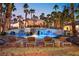 Backyard oasis featuring a cabana, pool with a basketball hoop, and lounge chairs at 2818 E Quail Ave, Las Vegas, NV 89120