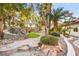 Backyard with a putting green and a natural rock water feature, perfect for recreation and relaxation at 2818 E Quail Ave, Las Vegas, NV 89120